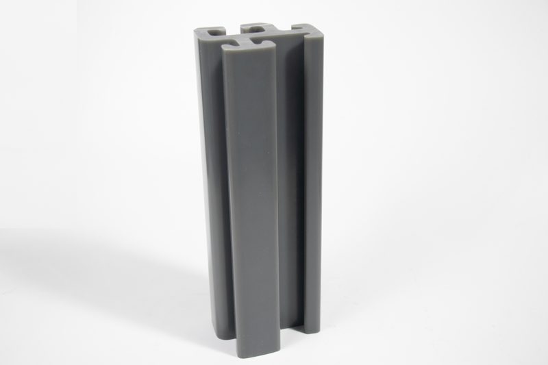 Real gray Z-profile PVC sheet piles stacked in separated bundles, with profile ends visible for delivery inspection.