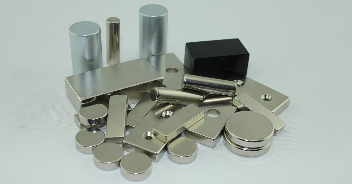 Assorted nickel-plated neodymium magnets in block, disc, cylinder and countersunk shapes.