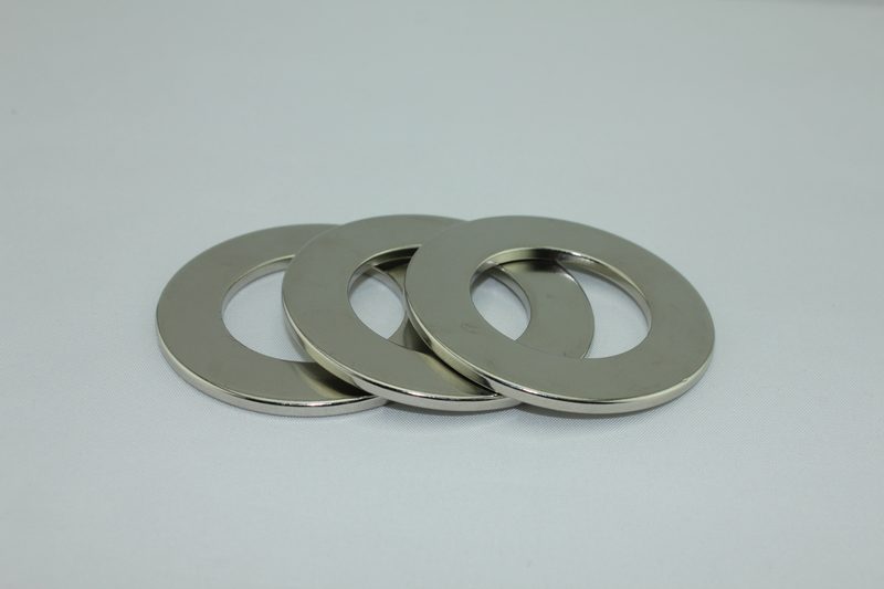 Assorted nickel-plated neodymium magnets in block, disc, cylinder and countersunk shapes.