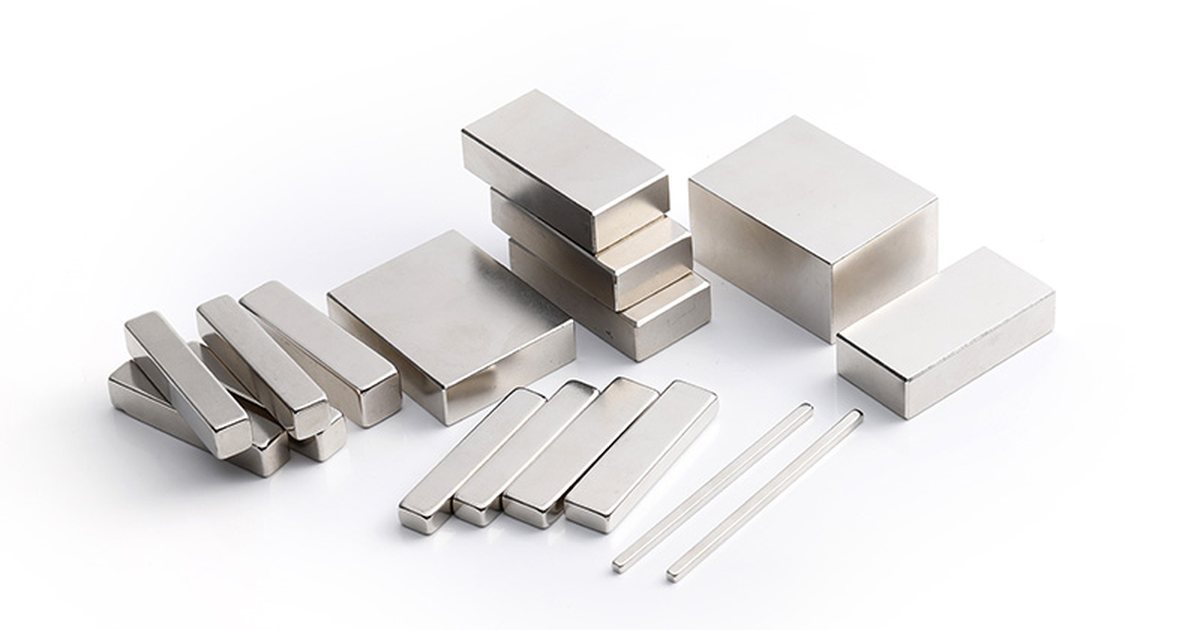 Nickel-plated neodymium block magnets in several rectangular sizes arranged on a white background.