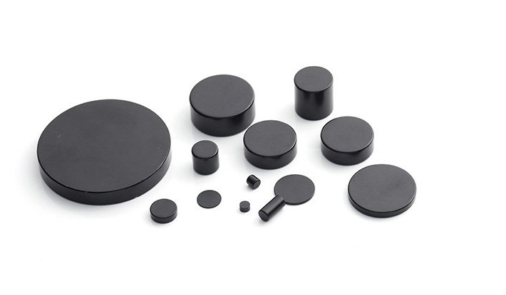 Nickel plated neodymium magnets in multiple shapes and sizes on a white background Nickel plated neodymium magnets in multiple shapes and sizes on a white background