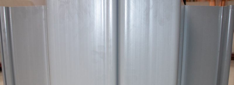 PVC sheet pile wall installed along a canal bank beside a water channel PVC sheet pile wall installed along a canal bank beside a water channel
