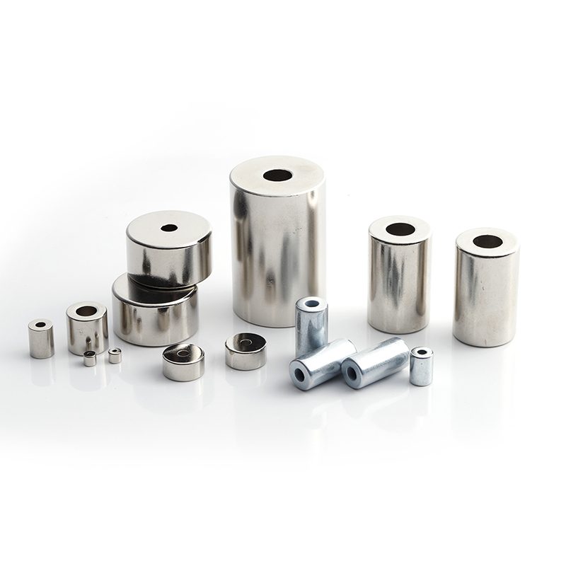 Zinc coated neodymium block magnets in multiple sizes on a white background Zinc coated neodymium block magnets in multiple sizes on a white background