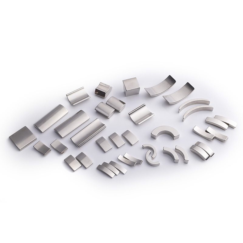 Nickel plated neodymium block magnets in assorted sizes on a white background Nickel plated neodymium block magnets in assorted sizes on a white background