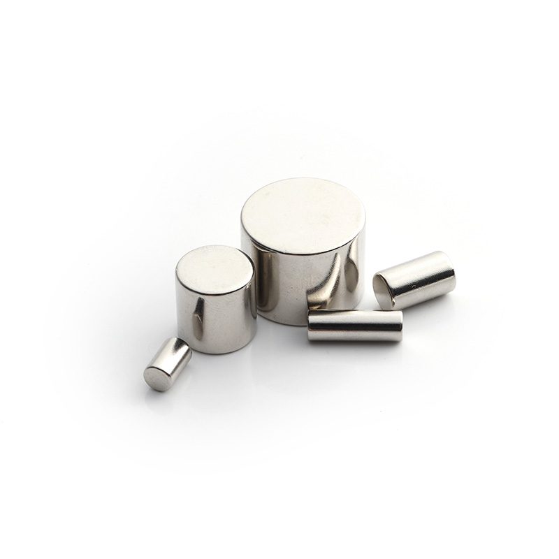 Small nickel-plated neodymium block magnets in assorted shapes on a white background Small nickel-plated neodymium block magnets in assorted shapes on a white background