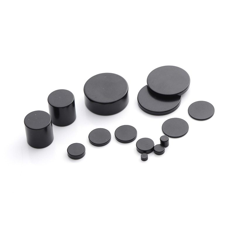 Assorted nickel-plated neodymium block magnets on a white background